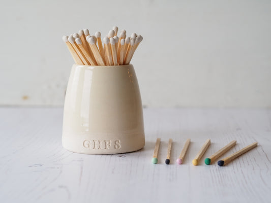 Ceramic match pot with colourful range of matches